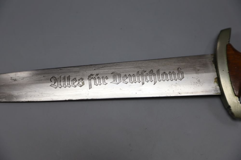 A German WW2 Third Reich SA dagger, by C. G. Haenel, Suhl, the 22cm blade, inscribed Alles Fur Deutschland with brown nickel mounted